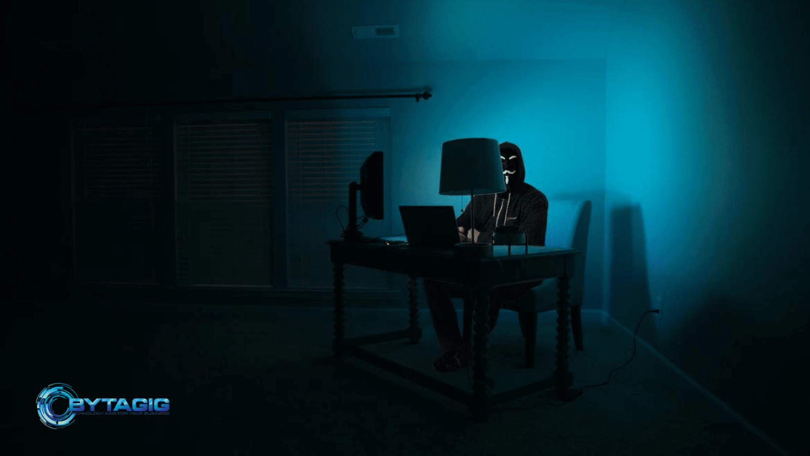 Dark room and a man using pc