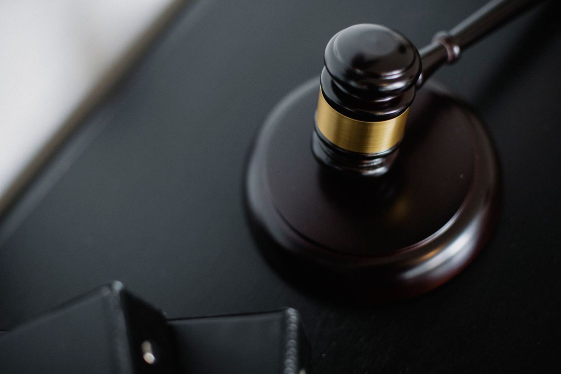 Wooden gavel on table in courtroom